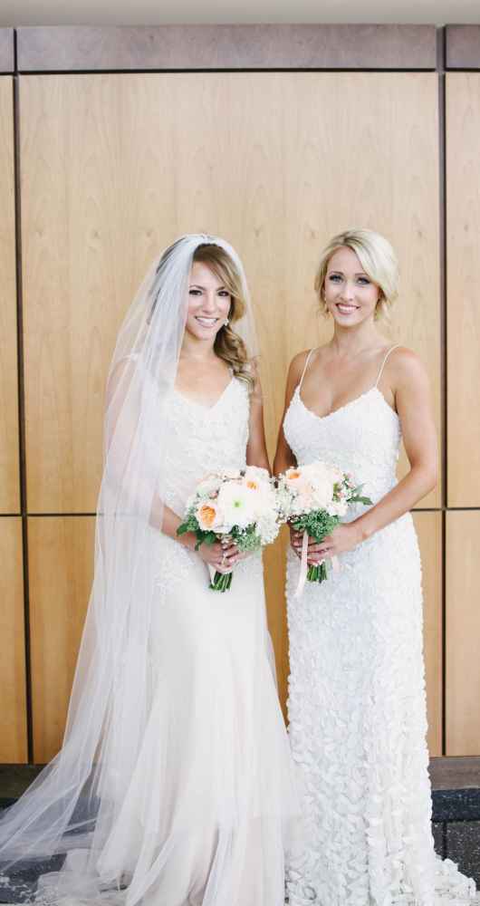 bride and bridesmaid in beautiful gown