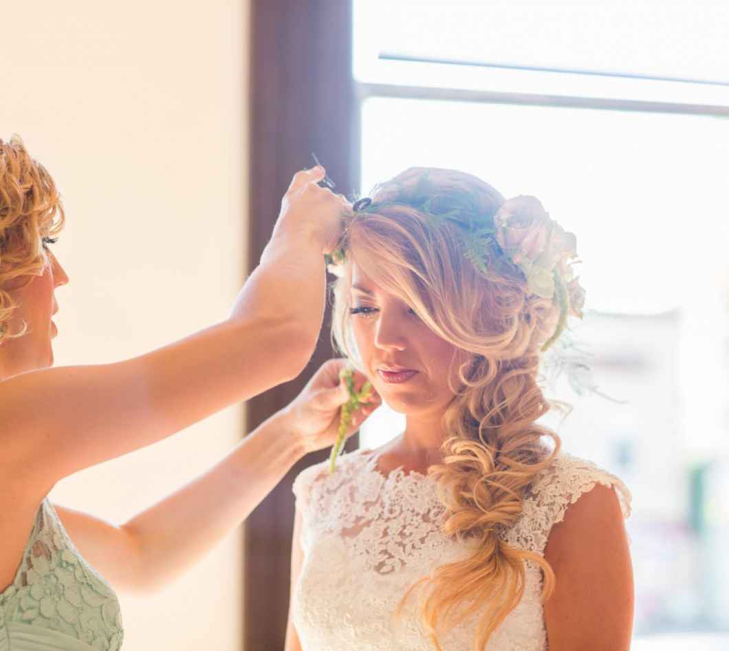 fixing bride's hair