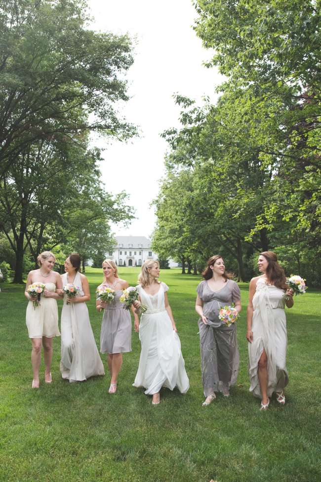 Bride Walking With Bridesmaids in Mismatched Dresses