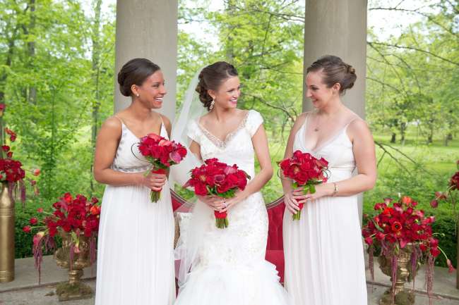 The bride and bridesmaids with red accents