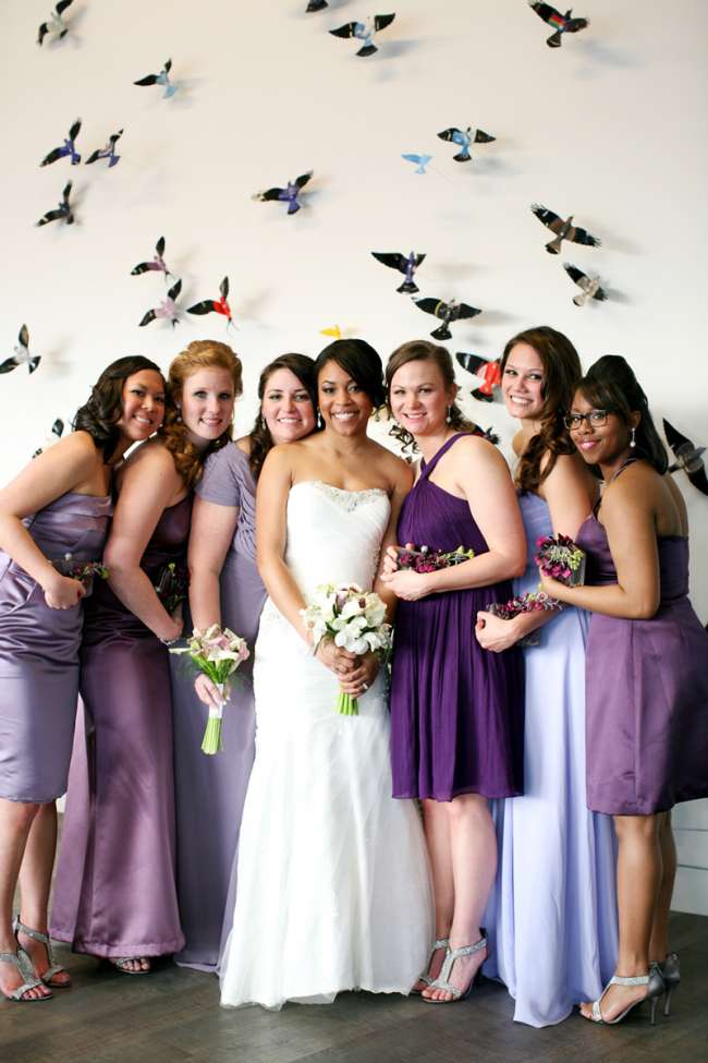 Bride With Her Bridesmaids in Mismatched Purple Dresses