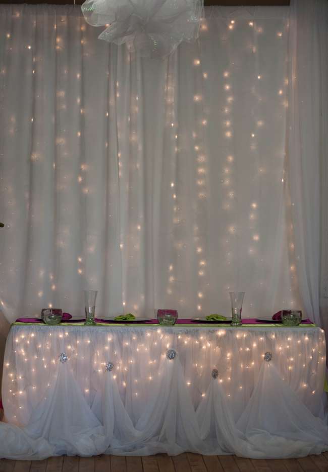 Draping and lights used as reception backdrop