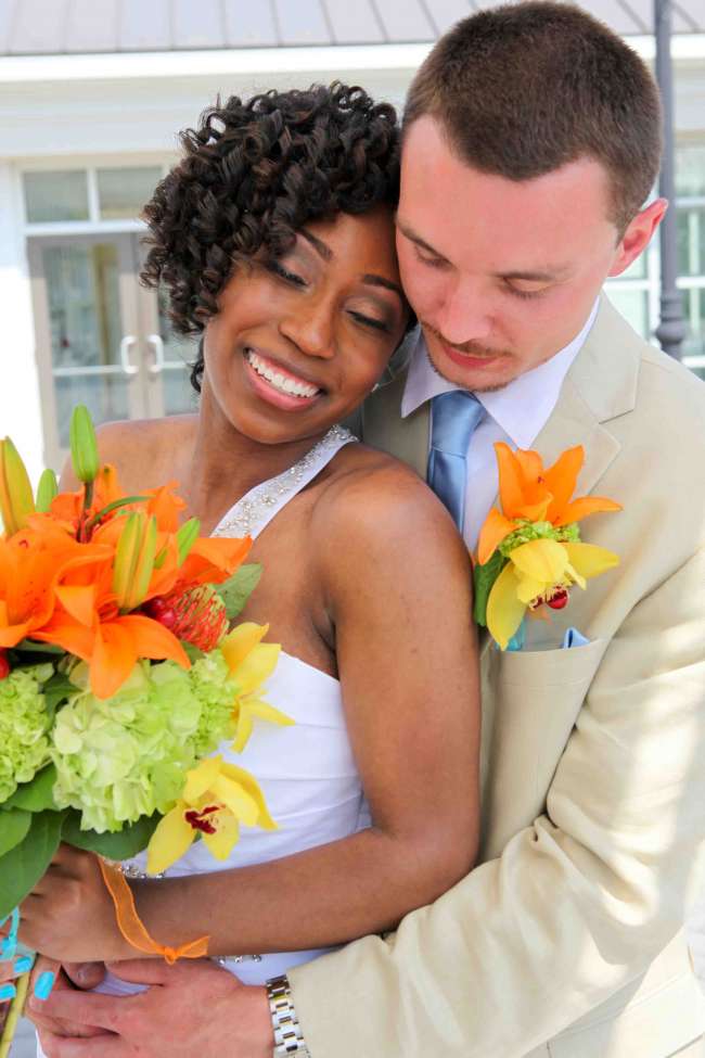 Happy Couple with Orange Bouquet