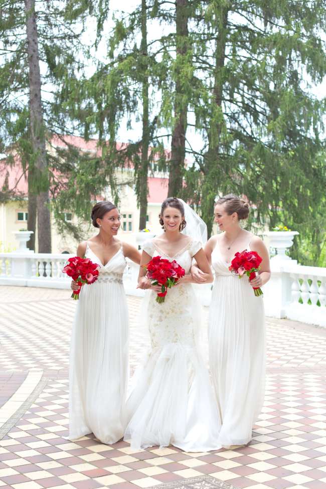 Bridesmaids pose with bride