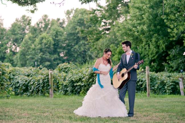 Groom Playing Guitar for Bride