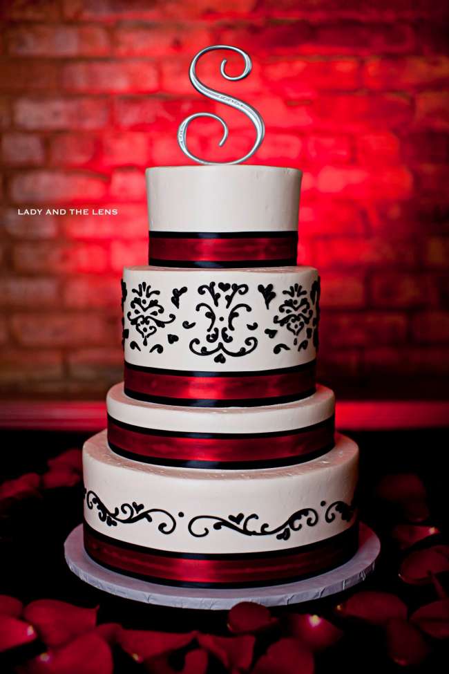 Vibrant red four tiered wedding cake