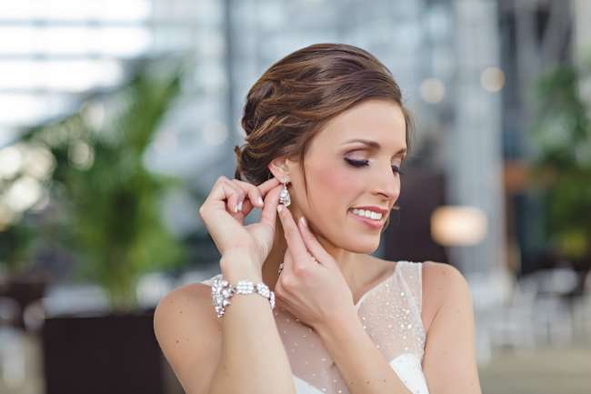 Bride Putting on Her Earring