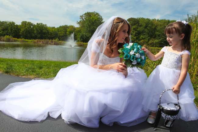 A Bride and her Flower Girl Outdoors
