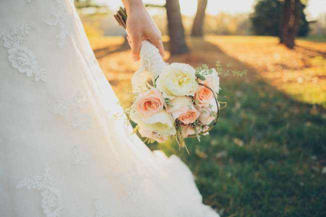 Bride Holding White & Peach Bouquet