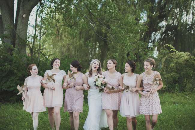 Bridesmaids in Mismatched Dresses Carrying Pinwheel Bouquets