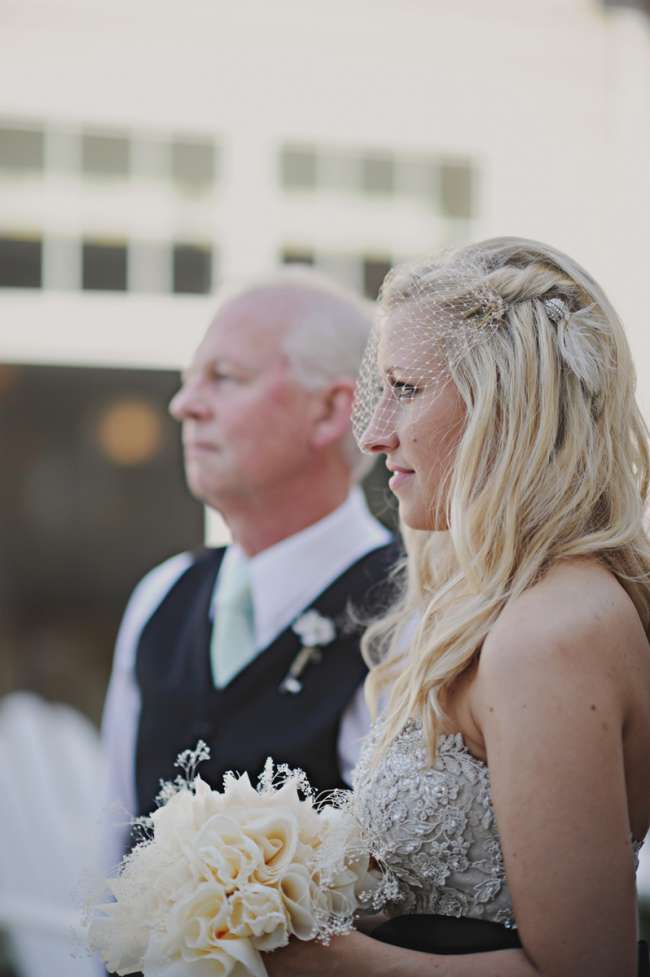 Bride With Birdcage Veil & Feather Hair Clip