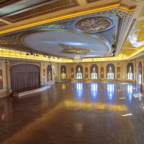 Gleaminag Ballroom dance floor with crystal chandelier and stage