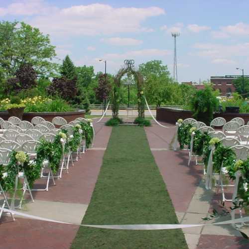 Outdoor wedding ceremony at Jon R. Hunt Plaza in front of Morris Performing Arts Center