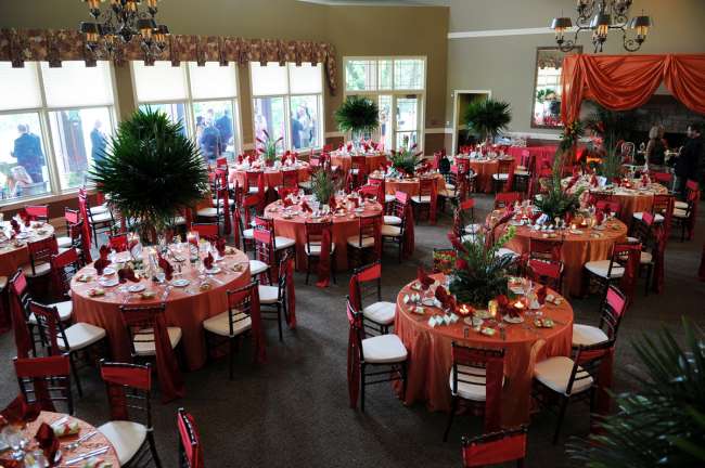 Red  & Orange Reception With Tall Greenery