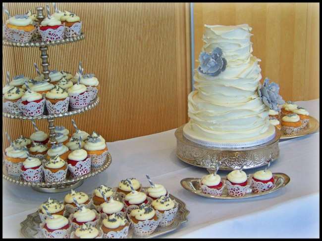 Vintage wedding cake with cupcakes