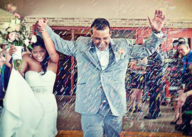 Couple Runs Through Confetti as They Leave the Ceremony