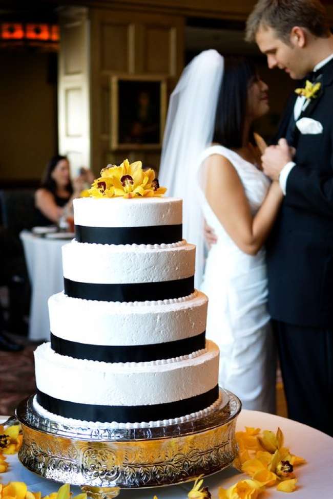 White Cake With Black Trim & Yellow Flowers