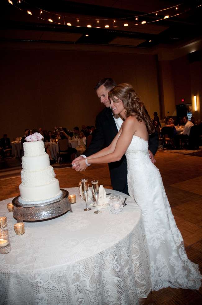 Cake cutting on lace tablecloth