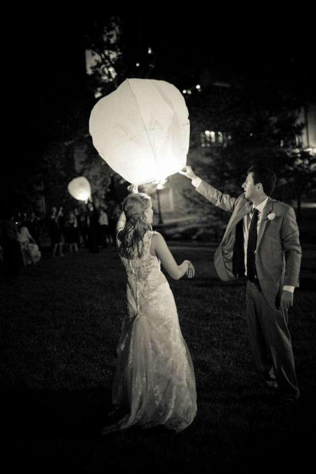 Bride and groom releasing lanterns