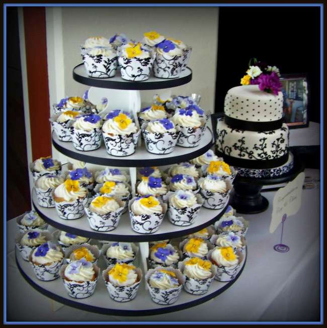 Wedding cake with accompanying cupcake tower