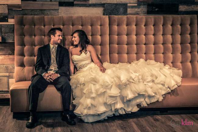 Bride & Groom Sitting on Couch 