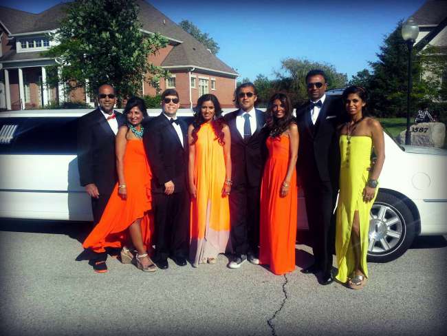 Wedding Party in Front of a Limousine