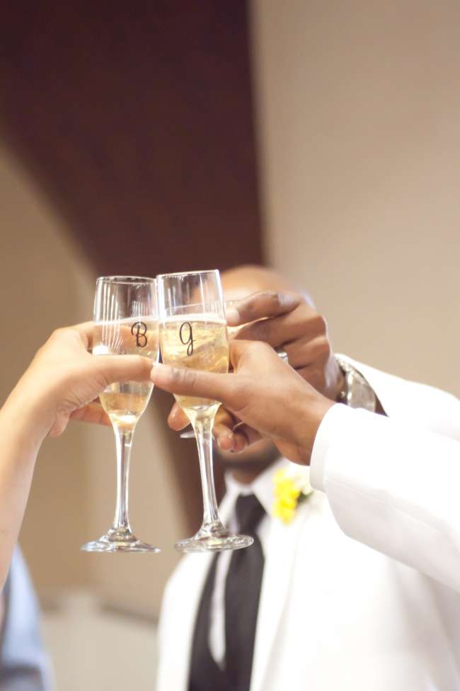 Bride & Groom Toast With Initialed Champagne Glasses
