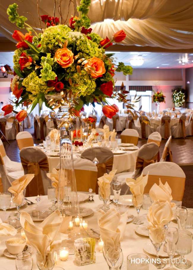 tall centerpieces on ivory linens
