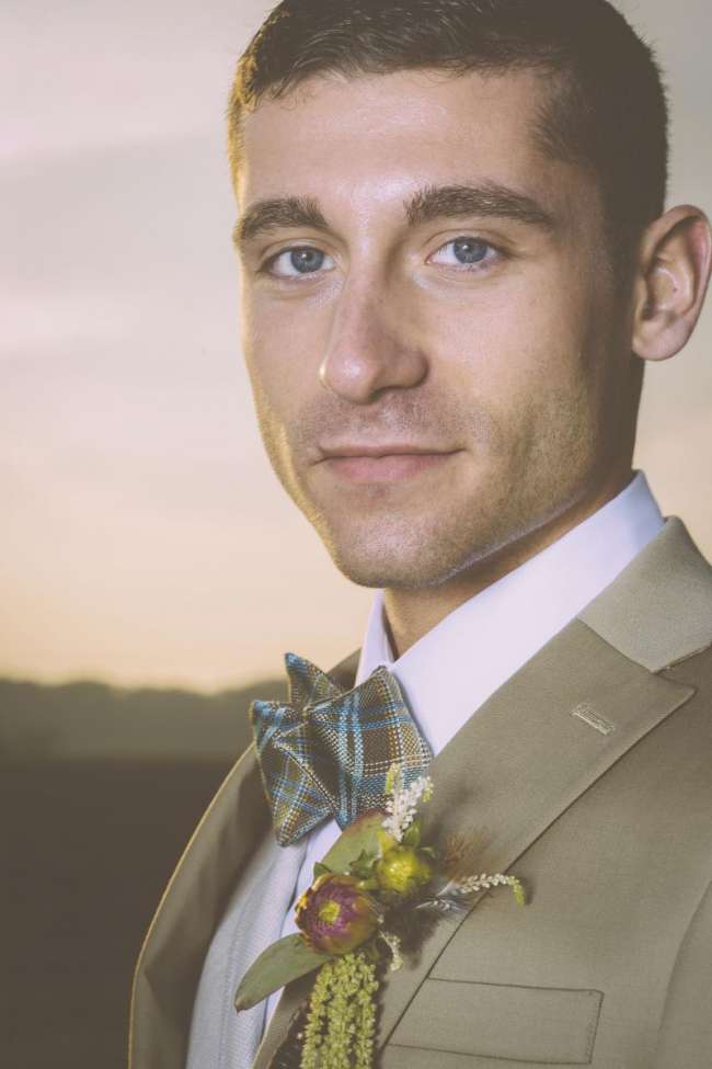 Groom in Plaid Bow Tie with Modern Boutonniere