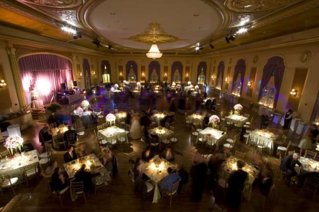Reception square tables for 8 with dramatic lighting