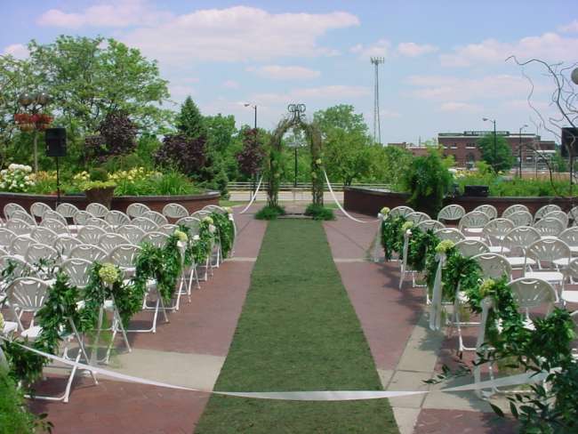 Outdoor wedding ceremony at Jon R. Hunt Plaza in front of Morris Performing Arts Center